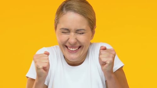 Woman Cheering and Smiling with Joyful Enthusiasm