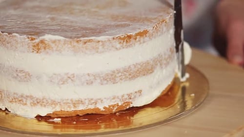 Cake Frosting Process: Delicious Baking Close Up