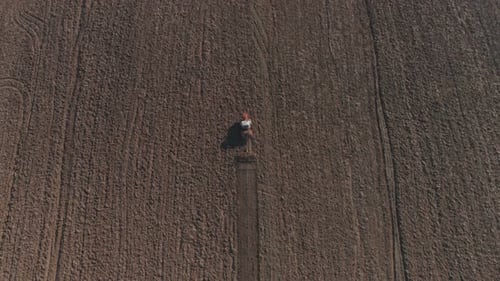 Agricultural Tractor Cultivating Field