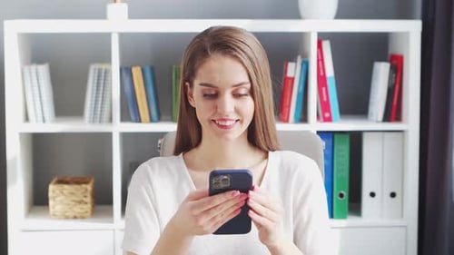 Young Woman Works at Home Office Using Computer.