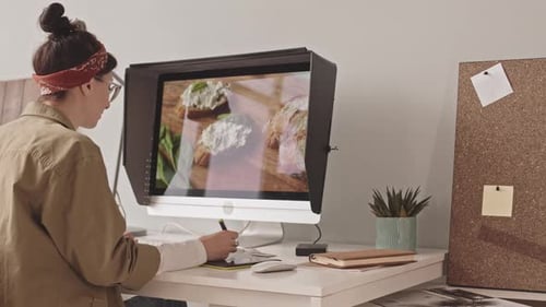 Female Photographer Editing Food Photos on PC