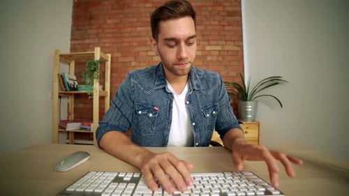POV of Stressed Handsome Male Freelancer Nervously Push Keyboard Buttons Trying to Start Broken