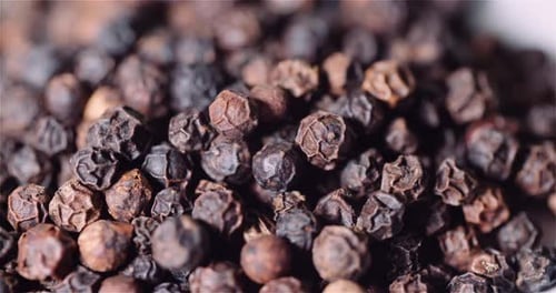 Pile of Dried Black Peppercorns Close Up
