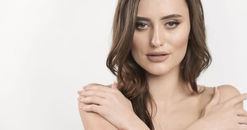 Glamorous Young Adult Woman with Wavy Hair Posing