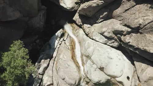 Dramatic Vista of Wild Mountainous Landscape with Cascading Waterfall
