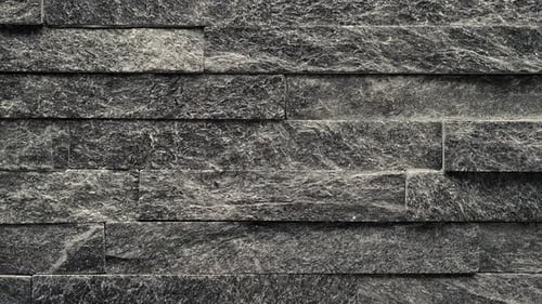 Textured Stone Wall Background in Gray and Black