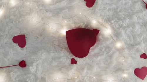Red Hearts and String Lights on Fluffy Surface