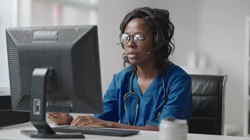 Young Woman Working in Telemedicine Office
