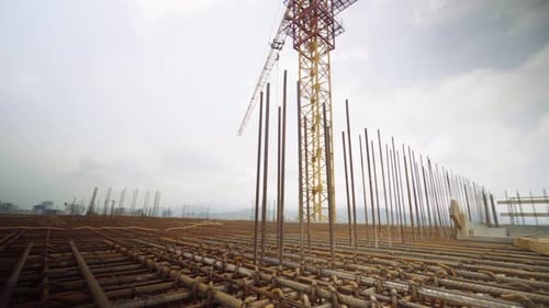 Iron reinforcement is basis for pouring foundation of house with concrete slab.