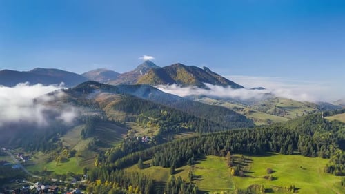Aerial View of Green Countryside Landscape in Autumn Mountains Nature with Foggy Clouds Motion