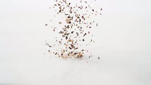 Ground Pepper Falling on White Surface