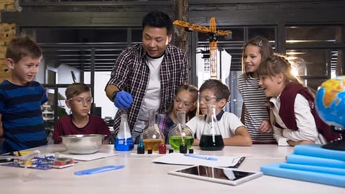Kids Doing Science Experiment with Smoke in Classroom