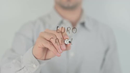 Man Writes Euro Crisis on Clear Surface