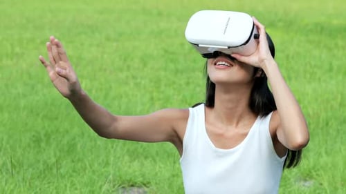 Woman watching with VR device at park