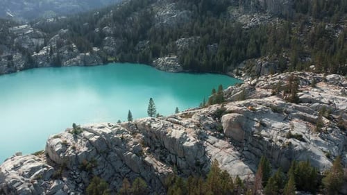 Aerial Mountain Glacier Lake with Turquoise Water Green Trees