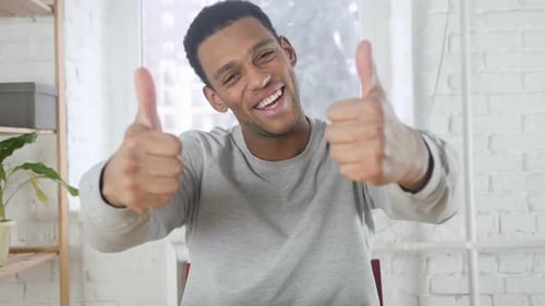Adult Man Gives Two Thumbs Up Indoors