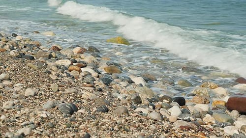 Colorful pebbles and stones washed by sea water