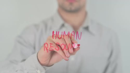 Man Writes Human Resources with Red Marker