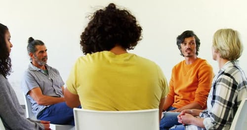 Adults Gather for Group Therapy Session Indoors