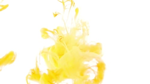 Yellow Paint Streams Flowing in Liquid