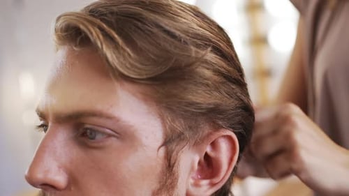 Young Adult Getting Hair Styled at Salon