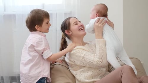 Happy Family Playing Together Indoors During Daytime