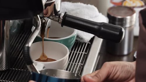 Espresso Machine Fills Coffee Cups in a Cafe