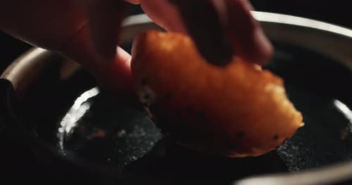 Burger Buns Being Toasted in Frying Pan