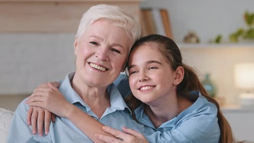 Loving Grandmother and Granddaughter Embrace Affectionately