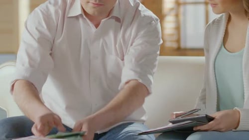 Male Counting Money, Putting It Aside, Hugging Female, Bank Mortgage, Happiness
