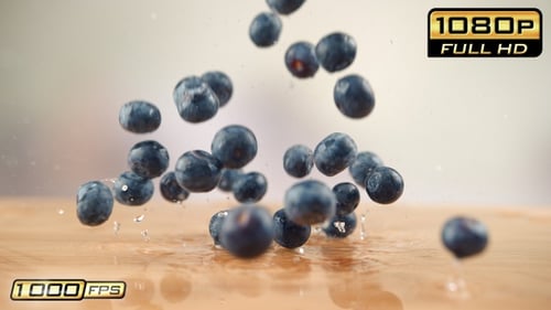 Blueberries Falling Onto Wet Wood Surface Slow Motion