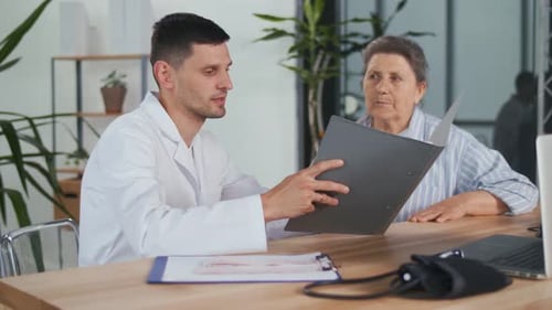 Doctor Discussing Results with Senior Woman in Office