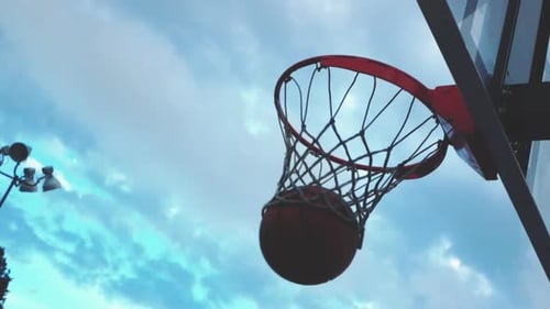 Basketball Scores in Hoop on Cloudy Day
