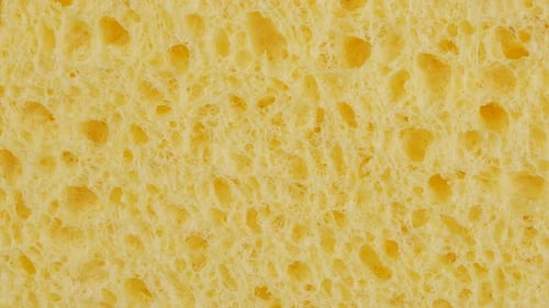 Gelbe Textur mit Schwam