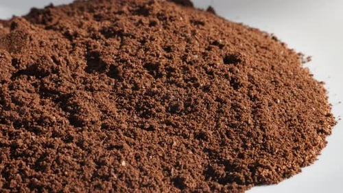 Close up of a mound of brown coffee grounds