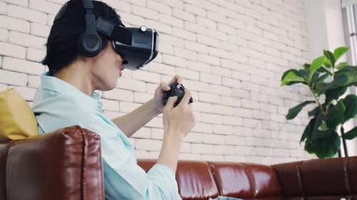 A man wearing virtual reality glasses experiencing innovative technology in the modern home.