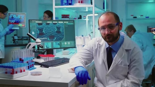 Researcher Sitting in Medical Laboratory