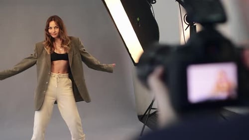 Female Model Posing for Photographer in Studio