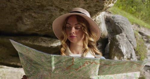 Woman Looking at Map Outdoors