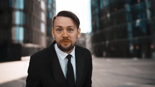 Angry man yelling in a suit in a city