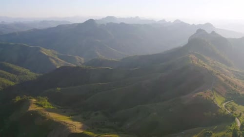 Aerial top view of forest trees and green mountain hills. Nature landscape background, Thailand.