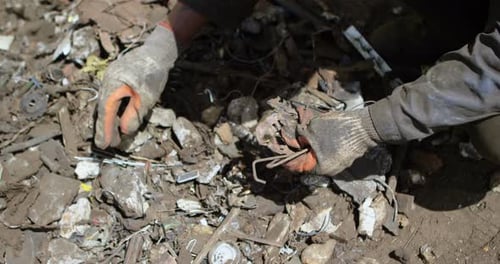 Male Worker Holding Scraps in The Junkyard 4k