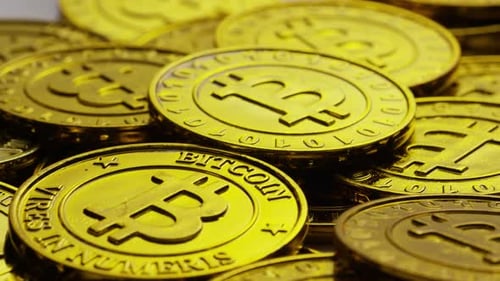 Rotating shot of Bitcoins (digital cryptocurrency) - BITCOIN