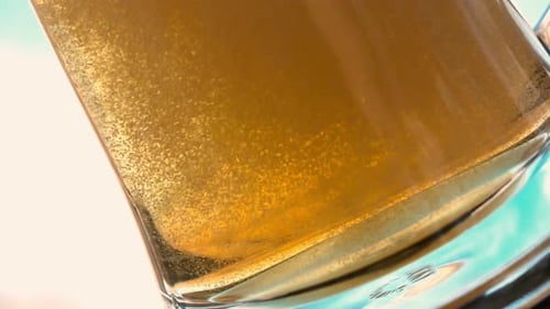 Close Up of Bubbling Refreshing Beer in Glass