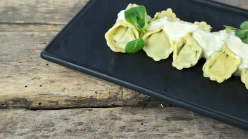 Pasta Dish with Cream Sauce on Rustic Wood