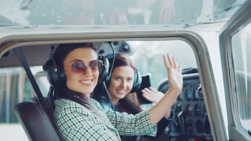 Women in Airplane Ready for Adventure