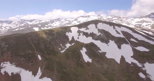 Breathtaking Aerial View of Snow-Capped Mountain Range
