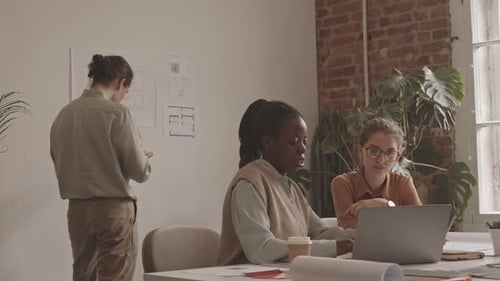 Team of Interior Designers Discussing Project in Office