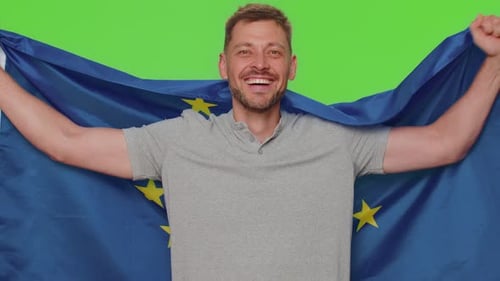Smiling Man Waving an EU Flag, Green Screen