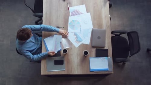 Male Works with Documents